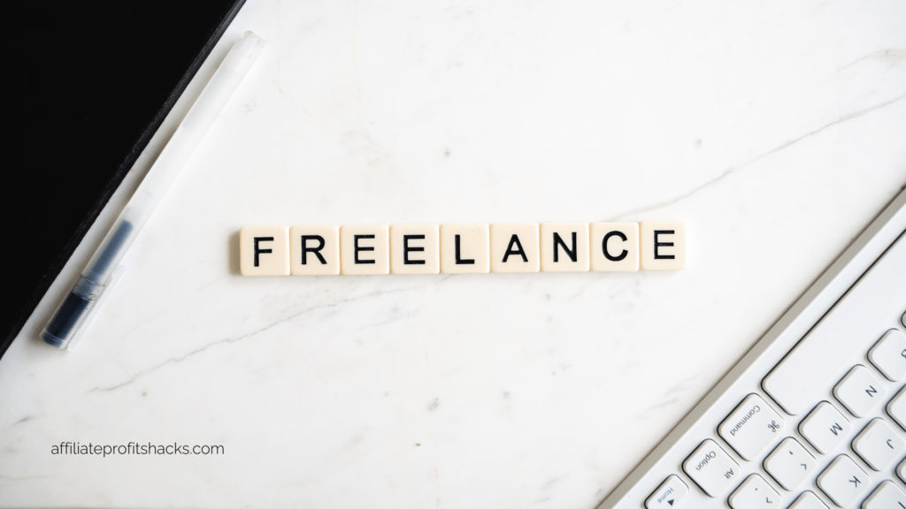 The word "FREELANCE" spelled out with individual letter tiles on a marble surface next to a pen and a keyboard.