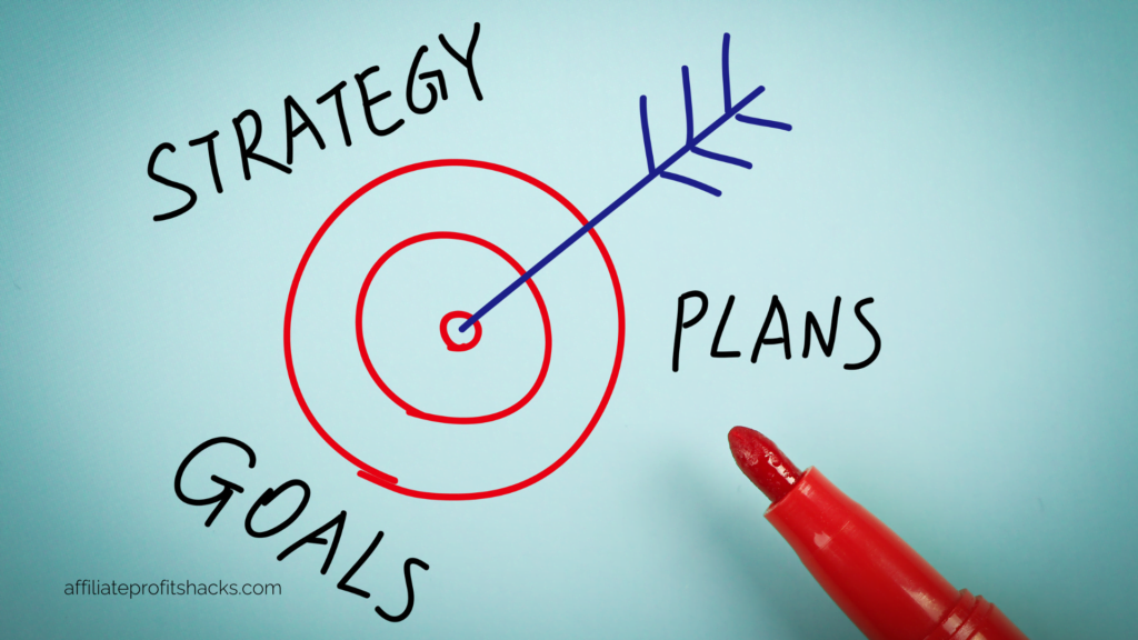 A concept diagram with a target and an arrow pointing to the center, labeled with "STRATEGY," "GOALS," and "PLANS," alongside a red marker.